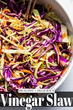 a white bowl filled with cabbage and carrots