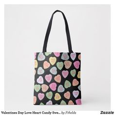 a black bag with pink, green and yellow hearts printed on the side that says valentine's day love heart candy by fificia