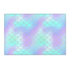 a pastel blue and green mermaid scales pattern placemat