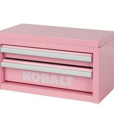 a pink kobalt box with two drawers on the front and one drawer open