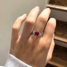 This beautiful ring features an emerald-cut ruby with a triad of natural earth-mined diamonds on both sides, all set in solid 14K white gold. This ring can be a lovely July birthstone gift for your loved ones! This ring is made with solid 14K Gold and naturally Earth-mined SI / G-H diamonds. If you're interested in purchasing this setting with a different center stone please message us! Vintage Engagement Rings Ruby, Ruby And Diamond Engagement Ring, Ruby Jewelry Ring, Ruby Ring Designs, Red Diamond Ring, Ruby Diamond Engagement Ring, Antique Ruby Ring, Red Ruby Ring, Ruby Wedding Rings