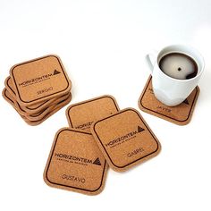 four coasters and a cup of coffee on a table