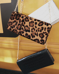 Our haircalf mini crossbody bag adds the perfect touch of animal intrigue. Foldover top. Chain handle. 8 1/2"L x 4 1/2"H x 1/14"W. Bag by Ann Taylor. Everyday Leopard Print Bag With Chain Strap, Leopard Print Crossbody Bag With Detachable Strap, Leopard Print Shoulder Bag With Detachable Strap For On-the-go, Leopard Print Shoulder Bag With Gold-tone Hardware, Leopard Print Bag With Gold-tone Hardware And Top Handle