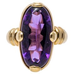 14k yellow gold ring. This pretty, uncommon ring has an elongated oval, half-faceted and half cabochon cut, dark purple color amethyst, set with wide prongs and finished with ribbed shoulders and a wide shank. Marks: 14k Dimensions: 3/8" across the top x 13/16" long Weight: 3.6 gross dwt Ring Size: 7 Purple Amethyst Ring, Purple Rings, Amethyst Ring, Purple Amethyst, Yellow Gold Rings, Dark Purple, Purple Color, Fashion Rings, Gold Rings