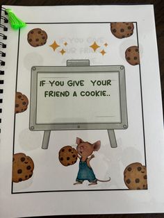 a notebook with an image of a mouse and some cookies on it that says if you give your friend a cookie