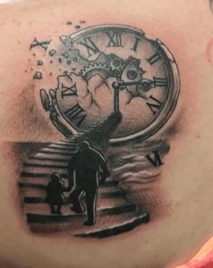 a man with a clock tattoo on his shoulder