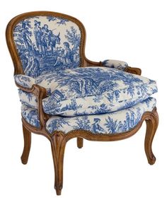 a blue and white chair with an upholstered arm rest on it's side