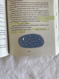 an open book with some writing on it's page and the pages are yellow