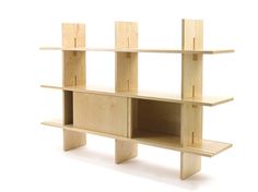 a wooden shelf with three shelves on each side and one section missing from the wall