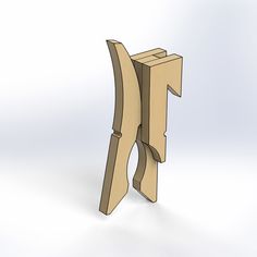 a wooden object that looks like it has been cut out to look like a letter