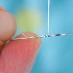 the needle is being used to make an ornament for something that looks like it's in motion