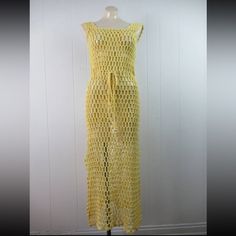 Vintage 1960s Or 70s Crotchet Knit Dress. Made Of Yellow Rayon/Cotton. Sleeveless. Floor Length. Has A Cinch Cord Waist. Hippy Bohemian Style. No Label. Size Medium. Actual Measurements Are: 30"(Stretches To 33") Around The Bust Line 27"(Stretches To 32") Around The Waist 31"(Stretches To 37") Around The Hips 52" Overall Length In Very Good Condition With A Faint Small Spot At Front Center(Photo). Vintage Crochet Dress, Vintage Crochet Dresses, No Label, Hippie Bohemian, Vintage Crochet, Vintage 1960s, Crochet Dress, Bohemian Style, Knit Dress