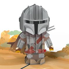 a lego star wars character standing in the middle of a desert with his helmet on