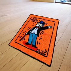 an orange door mat with a cartoon character on it