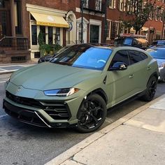 the lamb urus is parked on the side of the street