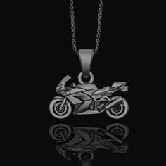 "Motorcycle, Pendant, Biker, Jewelry, Men's Accessory, Engine, Rider, Motorcycle Charm, Road, Engine Jewelry, Rider Charm Pendant Ignite the open road with our Motorcycle and rider-inspired jewelry collection. This range is tailored for the modern-day biker who finds freedom on two wheels. Each piece, from our engine jewelry to motorcycle charms and rider charm pendants, reflects the spirit of the road, making them the perfect companion for your journey. Whether you're a biker or a motorcycle en Motorcycle Necklace, Biker Party, Bike Aesthetic, Motorcycle Aesthetic, Biker Aesthetic, Pretty Bike, Biker Love, Biker Jewelry, Pretty Jewelry