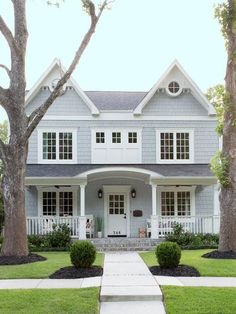 the front page of a magazine with an image of a house and trees in it