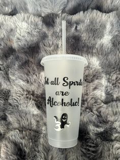 a plastic cup with the words it's all spirits are alchehol on it