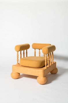 a chair made out of wood sitting on top of a white floor