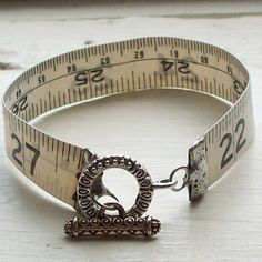 a measuring tape with a metal buckle on it