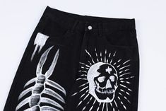 Make a bold statement with our Skeletal Graffiti Jeans. These eye-catching black denim pants feature striking white hand-painted designs, including a dramatic spine illustration, a radiant skull, and fiery heart motif. The artistic, punk-inspired aesthetic is perfect for those who love alternative fashion. With a straight-leg cut and classic 5-pocket styling, these jeans combine edgy artwork with a comfortable fit. Ideal for concerts, festivals, or creating a standout street-style look that's su Spine Illustration, Graffiti Jeans, Goth Streetwear, Black Denim Pants, Punk Inspiration, Heart Motif, Y2k Jeans, Printed Jeans, Black Denim Jeans