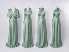 three dresses on mannequins, one in green and the other in white