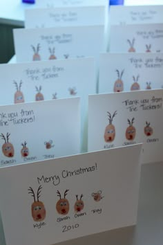 a group of christmas cards on top of each other in front of a computer screen