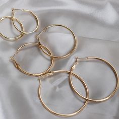 - Essential Hoop Earrings with a gold circle design, made of high quality stainless steel with gold plated. - Available in size small, medium and large. Minimalist Semi-circle Hoop Earrings As Gift, Gold-tone Metal Circle Hoop Earrings, Gold Nickel-free Open Circle Hoop Earrings, Gold-tone Polished Metal Hoop Earrings, Gold-tone Brass Hoop Earrings With Polished Finish, Stacked Jewelry, Circle Design, Circle Earrings, Gold Hoop Earrings