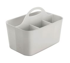 a white plastic caddy with four compartments on the bottom and two handles at the top