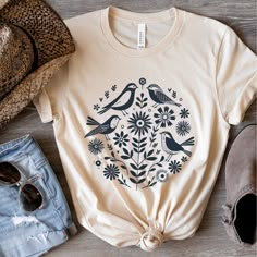 This simple, boho shirt is a great gift for any nature, bird, or flower lover with a bohemian sense of style ❤️Love the design and want it in a sweatshirt? We got you covered. Tap here:   SHORT SLEEVE TSHIRT FIT: ⚡️TAPERED SHOULDERS - so it retains its shape even after washing. ⚡️CREW NECKLINE adds a timeless, classic touch and a neat appearance that is perfect for showcasing accessories like necklaces or scarves.  COMFORT / QUALITY / MATERIAL ⚡️Soft cotton & quality print ⚡️Polyester and cotton Bohemian Vintage Print T-shirt For Spring, Bohemian Summer T-shirt With Plant Print, Spring Bohemian T-shirt With Graphic Print, Bohemian Spring Printed T-shirt, Bohemian Floral Print Cotton T-shirt, Spring Boho, Nature Shirts, Boho Shirts, Simple Gifts