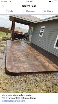 a wooden deck in front of a house