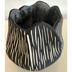 a black and white bowl with zebra stripes