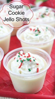 small plastic cups filled with sugar cookie jello shots on top of a red tray