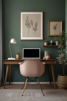 a laptop computer sitting on top of a wooden desk next to a potted plant