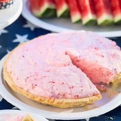 there is a watermelon pie on the table with other desserts around it