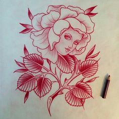 a drawing of a woman's face surrounded by flowers and leaves with a pen