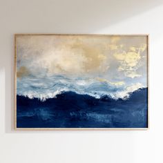 a painting hanging on the wall above a couch