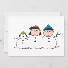 a card with three cartoon characters in the snow, one is wearing a hat and the other has a beanie