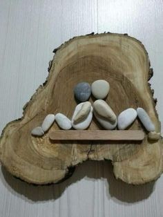 a piece of wood that has some rocks on it