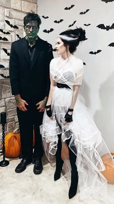 a man and woman dressed up in halloween costumes