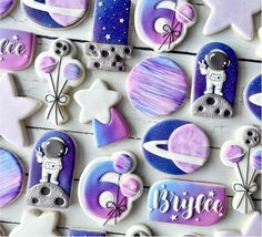 some cookies are decorated with space and stars