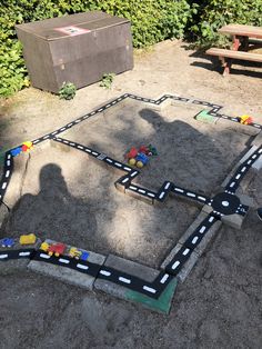 a child's play area with toy cars and blocks