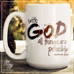 a white coffee mug with the words god all things are possible in brown on it