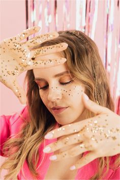 a woman with glitter on her hands