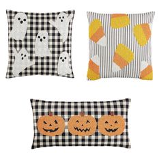 three halloween pillows with pumpkins and jack - o'- lanternes on them