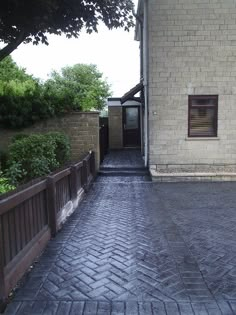 a brick building with a wooden gate next to it