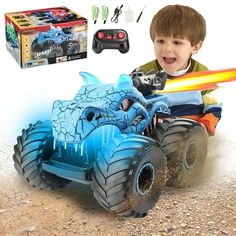 a young boy playing with a remote control monster truck