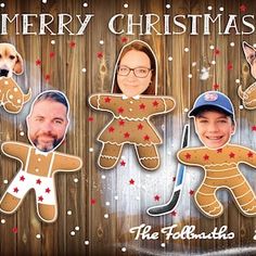 three cardboard cutouts of people and dogs in front of a wooden background with the words merry christmas