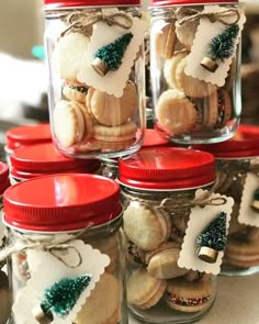 several jars filled with cookies and christmas decorations