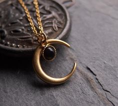 A bewitching necklace: the delicate onyx drop is a perfect match for the matte finished, 24k gold plated brass moon. This piece looks gorgeous worn on its own or is fantastic layered with other necklaces. ⟴ Onyx is the ancient birthstone for July and is associated with the zodiac sign of LeoTurquoise: https://www.etsy.com/ca/listing/735203333/moon-necklace-celestial-jewelryAmethyst: https://www.etsy.com/ca/listing/741246762/amethyst-necklace-boho-necklaceMoonstone: https://www.etsy.com/ca/listin Physical Manifestation, Oddities Jewelry, Witch Moon, Half Moon Necklace, Moon Necklace Silver, Black Onyx Necklace, Magic Aesthetic, Crescent Moon Pendant, Witch Jewelry